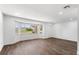 Spacious living room with wood floors, a large window, and recessed lighting at 611 Lakespur Ln, Altamonte Springs, FL 32714