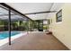 Enclosed patio featuring a view of the backyard pool at 611 Lakespur Ln, Altamonte Springs, FL 32714