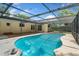 Backyard pool and patio surrounded by an enclosed screened in patio at 611 Lakespur Ln, Altamonte Springs, FL 32714