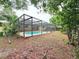 Enclosed pool with screen surround and covered patio area at 611 Lakespur Ln, Altamonte Springs, FL 32714