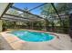 Backyard pool surrounded by an enclosed screened in patio at 611 Lakespur Ln, Altamonte Springs, FL 32714