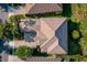 Beautiful birds-eye view of the house showcasing the roof, landscaping, and paver driveway at 7536 Green Mountain Way, Winter Garden, FL 34787