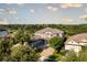 Aerial view of a large, well-maintained home with a tile roof and mature landscaping at 7536 Green Mountain Way, Winter Garden, FL 34787