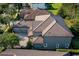 Great aerial view of a home showing the three car garage, landscaping and roof at 7536 Green Mountain Way, Winter Garden, FL 34787