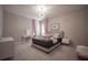 Bright bedroom with a large bed, modern lighting, and stylish decor at 7536 Green Mountain Way, Winter Garden, FL 34787