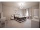 Bright bedroom with a large bed, modern lighting, and stylish decor at 7536 Green Mountain Way, Winter Garden, FL 34787