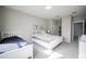 Bedroom featuring two twin beds, light-colored walls, and abundant natural light at 7536 Green Mountain Way, Winter Garden, FL 34787