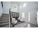 Grand foyer with soaring ceilings, natural light, and a staircase, creating an inviting first impression for guests at 7536 Green Mountain Way, Winter Garden, FL 34787