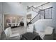 Spacious foyer with a view into the dining area and staircase featuring seating creating an inviting entrance into the home at 7536 Green Mountain Way, Winter Garden, FL 34787