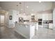 Spacious kitchen featuring white cabinetry, granite countertops, an island, and stainless steel appliances at 7536 Green Mountain Way, Winter Garden, FL 34787