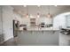 Bright kitchen featuring granite countertops, stainless steel appliances, and a center island at 7536 Green Mountain Way, Winter Garden, FL 34787