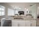 Kitchen island with granite countertops, stainless steel appliances, and stylish pendant lighting at 7536 Green Mountain Way, Winter Garden, FL 34787