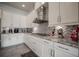 Granite countertops, tiled backsplash, and ample cabinet space highlight this well-equipped kitchen at 7536 Green Mountain Way, Winter Garden, FL 34787