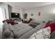 Spacious living area with a large sectional sofa, recliners, and modern media center at 7536 Green Mountain Way, Winter Garden, FL 34787