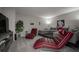 Stylish living room with comfortable seating, decorative accents, and a modern entertainment center at 7536 Green Mountain Way, Winter Garden, FL 34787