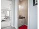 Stylish powder room featuring a granite countertop, white cabinets, and adjacent access to a bedroom at 7536 Green Mountain Way, Winter Garden, FL 34787