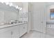 Bathroom with double vanity, granite countertops, and tiled floors at 8833 Cruden Bay Ct, Davenport, FL 33896