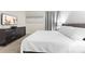 Bedroom featuring white linens, grey carpet and dresser at 8833 Cruden Bay Ct, Davenport, FL 33896