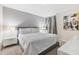 Cozy bedroom with a comfortable bed, a neutral color scheme and carpeted flooring at 8833 Cruden Bay Ct, Davenport, FL 33896