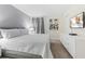 Comfortable bedroom featuring a plush bed, a modern dresser, and a wall-mounted TV at 8833 Cruden Bay Ct, Davenport, FL 33896