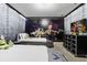 Themed bedroom with two twin beds, 'Toy Story' mural, and dresser at 8833 Cruden Bay Ct, Davenport, FL 33896