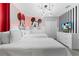 Whimsical bedroom featuring Mickey and Minnie Mouse decor, perfect for  at 8833 Cruden Bay Ct, Davenport, FL 33896