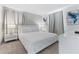 The bedroom features a king bed, with a neutral color scheme, large windows, and matching night stands at 8833 Cruden Bay Ct, Davenport, FL 33896