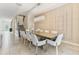 Refined dining area features a modern chandelier and decorative wall paneling at 8833 Cruden Bay Ct, Davenport, FL 33896