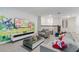 A comfortable living room with Paw Patrol themed decorations, a sleek coffee table, and plush seating at 8833 Cruden Bay Ct, Davenport, FL 33896