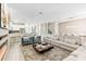 Spacious living area features modern furnishings and an open layout to the kitchen and dining area at 8833 Cruden Bay Ct, Davenport, FL 33896
