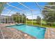 Screened in pool and spa with a view of the golf course at 8833 Cruden Bay Ct, Davenport, FL 33896