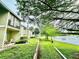 Condo backyard with a lush green lawn, water view and easy access to outdoor relaxation at 912 Lake Destiny Rd # F, Altamonte Springs, FL 32714