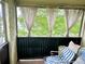 Relaxing screened in balcony with a comfortable lounge chair and peaceful view of greenery at 912 Lake Destiny Rd # F, Altamonte Springs, FL 32714