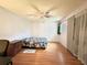 Bright bedroom with wood flooring, large window, ceiling fan, and ample closet space at 912 Lake Destiny Rd # F, Altamonte Springs, FL 32714