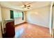 Empty bedroom featuring light walls, wood floors, a window, and a ceiling fan at 912 Lake Destiny Rd # F, Altamonte Springs, FL 32714