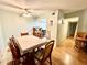 Inviting dining room area with ceiling fan adjacent to the kitchen and hallway with breakfast bar at 912 Lake Destiny Rd # F, Altamonte Springs, FL 32714