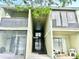 Two-story condo featuring an outdoor patio with chairs and second story screened in porch at 912 Lake Destiny Rd # F, Altamonte Springs, FL 32714