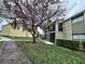 The exterior of the building features mature trees, sidewalks, and grass at 912 Lake Destiny Rd # F, Altamonte Springs, FL 32714