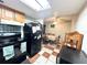 The kitchen features appliances, wood cabinets, unique flooring, and a skylight at 912 Lake Destiny Rd # F, Altamonte Springs, FL 32714