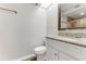 Bright bathroom with granite countertops, updated sink, and view of the glass enclosed shower at 950 Vanessa Ct # F, Port Orange, FL 32127