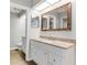 Well-lit bathroom featuring granite countertops, ample counter space, and white cabinets at 950 Vanessa Ct # F, Port Orange, FL 32127