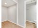 Hallway featuring laminate flooring leading to the bathroom at 950 Vanessa Ct # F, Port Orange, FL 32127