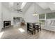 Bright living room featuring vaulted ceilings, skylights, fireplace and sliding door access at 950 Vanessa Ct # F, Port Orange, FL 32127