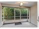 Relaxing screened porch with outdoor access and ceiling fan at 950 Vanessa Ct # F, Port Orange, FL 32127
