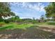 View of the home exterior with a large yard and pool enclosure at 103 Longhorn Rd, Winter Park, FL 32792