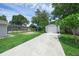 Spacious backyard featuring a well-maintained lawn, shed, and screened-in enclosure, perfect for outdoor enjoyment at 103 Longhorn Rd, Winter Park, FL 32792