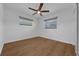 A spacious bedroom featuring hardwood floors and bright window views at 103 Longhorn Rd, Winter Park, FL 32792