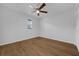 Bedroom with ceiling fan, wood floors, window with blinds, and closet at 103 Longhorn Rd, Winter Park, FL 32792