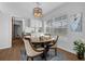 Cozy dining room with hardwood floors and a view into the kitchen at 103 Longhorn Rd, Winter Park, FL 32792