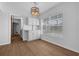 Dining area with wood floors, natural light and view into the kitchen at 103 Longhorn Rd, Winter Park, FL 32792